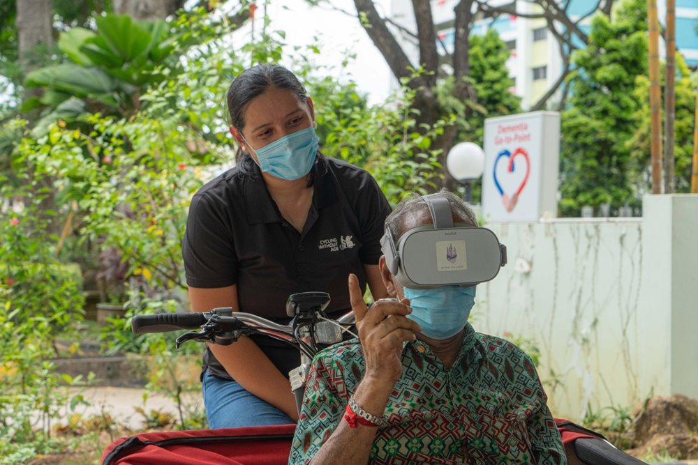 Elderly enjoy virtual reality trishaw rides without stepping out